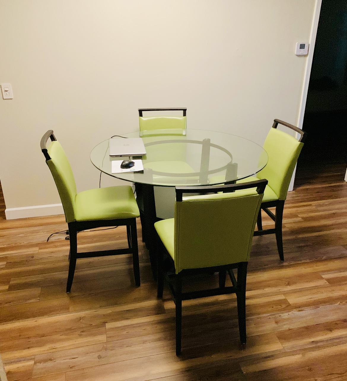 ROOMS TO GO® modern glass dining table with cherry wood legs and 4 green chairs ROOMS TO GO® modern glass dining table with cherry wood legs and 4 green chairs