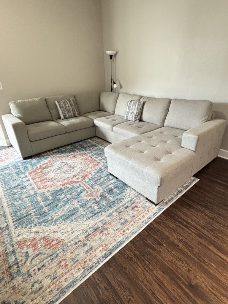 Sofa sectional sandy gray color with return + pop-up sleeper and storage chaise