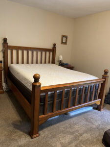 New Classic Furniture "Honey Creek" Queen Poster Bed Frame – Caramel Oak Wood